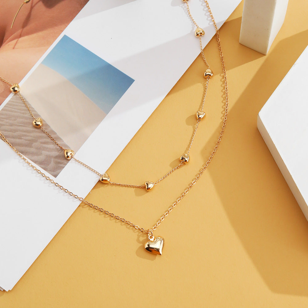 Gold Multi-Row Necklace with Heart Pendant