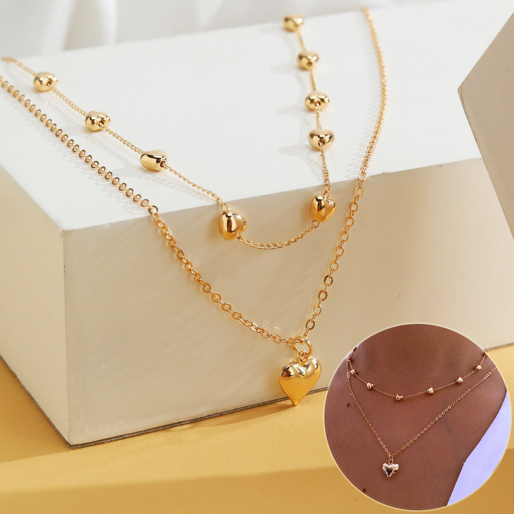 Gold Multi-Row Necklace with Heart Pendant