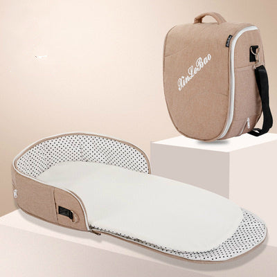 Diaper backpack with foldable bed