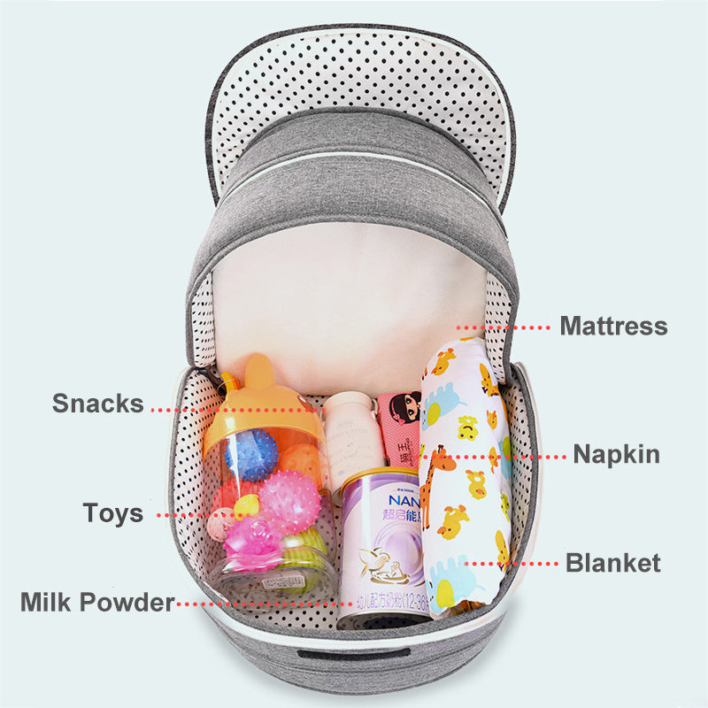 Diaper backpack with foldable bed