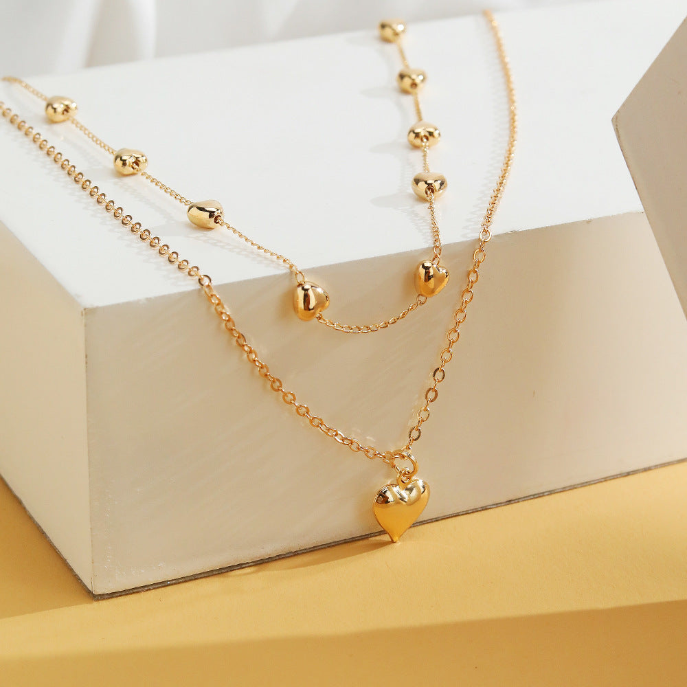 Gold Multi-Row Necklace with Heart Pendant